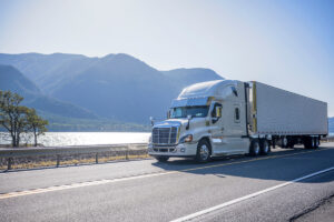 A truck driving past a lake in El Paso.